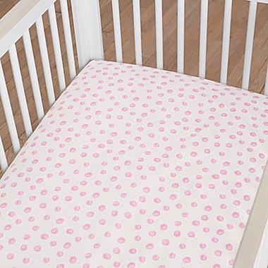 Just Born&reg; One World&trade; Collection Blossom Polka Dot Fitted Sheet in Pink/White. View a larger version of this product image.