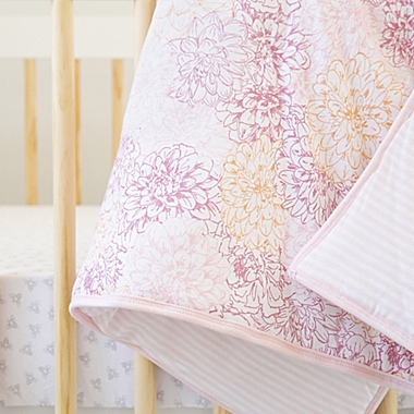 Burt&#39;s Bees Baby&reg; Peach Floral Reversible Quilt in Blossom. View a larger version of this product image.