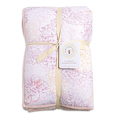 Burt&#39;s Bees Baby&reg; Peach Floral Reversible Quilt in Blossom. View a larger version of this product image.