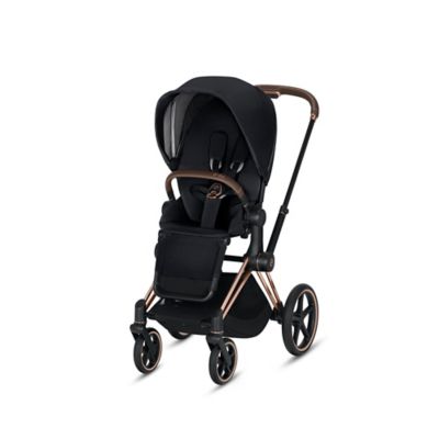 white and gold stroller