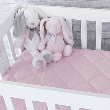 Ely&#39;s &amp; Co. Quilted Waterproof Playard Fitted Sheet in Pink. View a larger version of this product image.