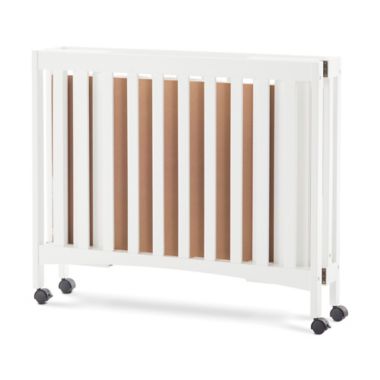 Forever Eclectic by Child Craft London Folding Mini Crib in Matte White. View a larger version of this product image.