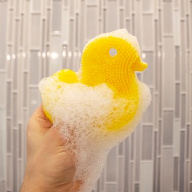 Innobaby&reg; Duck Bath Scrub in Yellow. View a larger version of this product image.