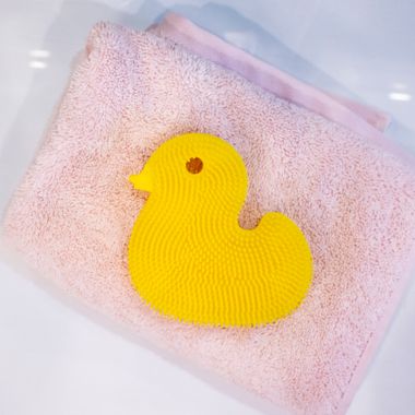 Innobaby&reg; Duck Bath Scrub in Yellow. View a larger version of this product image.