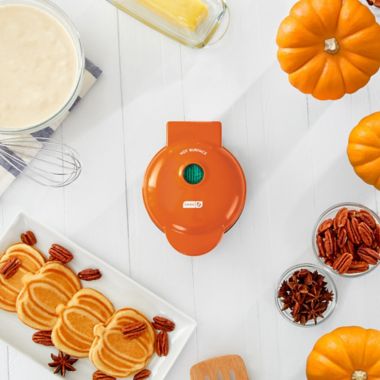 DASH&trade; Pumpkin Mini Waffle Maker in Orange. View a larger version of this product image.