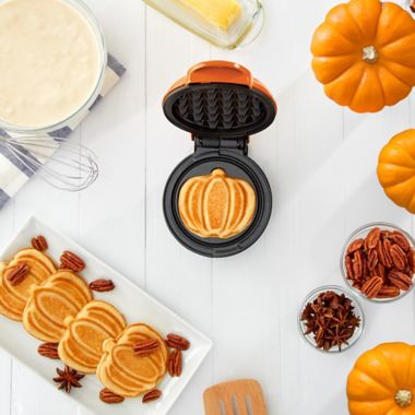 DASH&trade; Pumpkin Mini Waffle Maker in Orange. View a larger version of this product image.