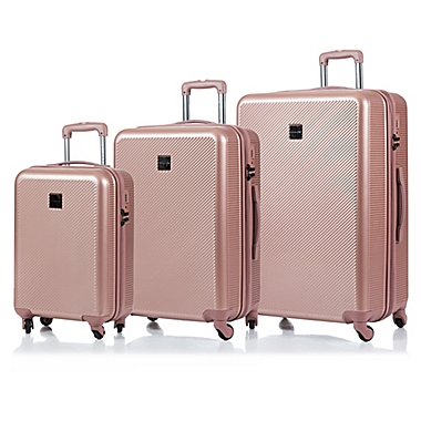 CHAMPS Iconic 3-Piece Hardside Expandable Spinner Luggage Set in Rose Gold. View a larger version of this product image.