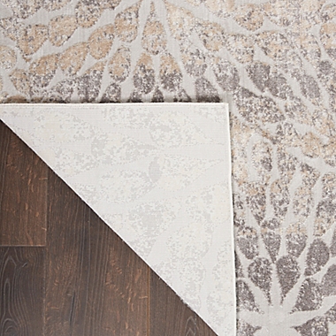 Nourison Sleek Textures Abstract Floral 3&#39;11 x 5&#39;11 Area Rug in Ivory/Beige. View a larger version of this product image.