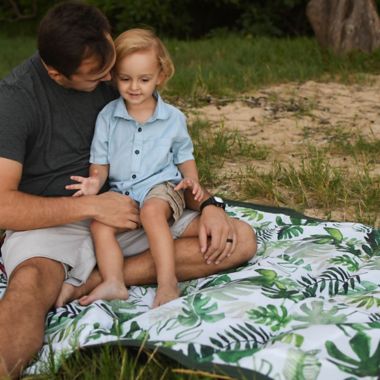 Little Unicorn&reg; Tropical 5&#39; x 7&#39; Outdoor Blanket in Green/White. View a larger version of this product image.