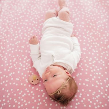 Copper Pearl&trade; Lucy Premium Fitted Crib Sheet in Pink. View a larger version of this product image.