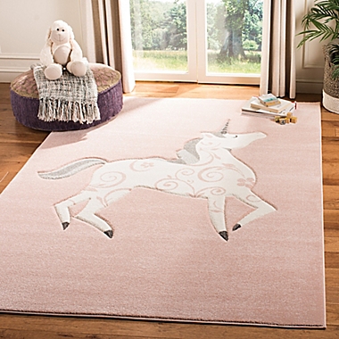 Safavieh Carousel Kids 3&#39;3 x 5&#39;3 Unicorn Area Rug in Pink. View a larger version of this product image.