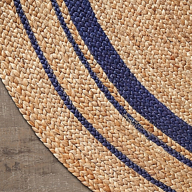 4&#39; Round Kerala Sunrise Jute Area Rug. View a larger version of this product image.