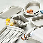 Alternate image 6 for Rachael Ray&trade; Nonstick Carbon Steel 3-Piece Bakeware Pan Set with Swing Lid in Silver