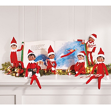 The Elf on the Shelf&reg; A Christmas Tradition Book Set with Brown Skin Tone Girl Elf. View a larger version of this product image.