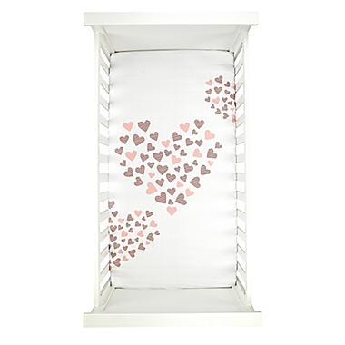 Lambs &amp; Ivy&reg; Heart To Heart Fitted Crib Sheet in Pink/White. View a larger version of this product image.