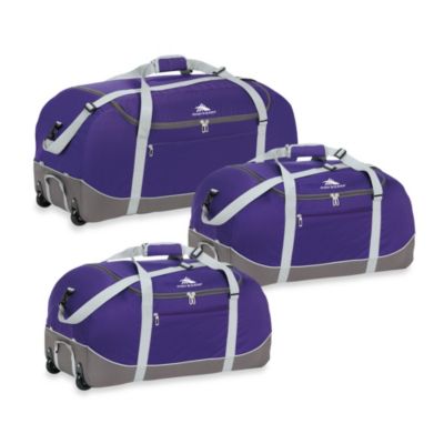 purple duffle bag with wheels