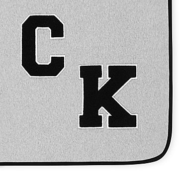 CK MC VARSITY THROW HEATHER GREY/CHARCOAL 50X70. View a larger version of this product image.