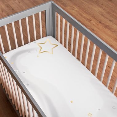 Just Born&reg; Sparkle Fitted Crib Sheet in Ivory. View a larger version of this product image.