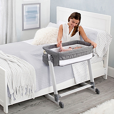 Delta Children By the Bed Deluxe Sleeper Bassinet in Grey. View a larger version of this product image.