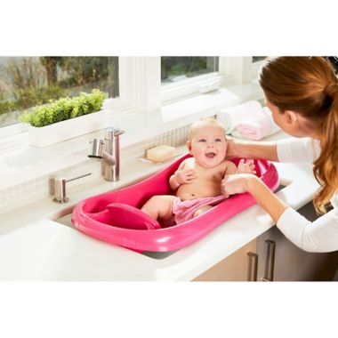 The First Years Pink Sure Comfort Deluxe Newborn-to-Toddler Tub in Pink. View a larger version of this product image.