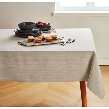 Our Table&trade; Textured 60-Inch x 120-Inch Oblong Tablecloth in Natural. View a larger version of this product image.