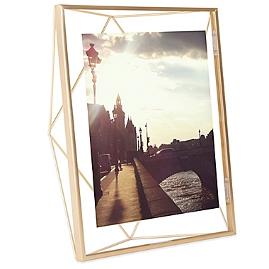 Umbra&reg; Prisma 8-Inch x 10-Inch Photo Frame in Matte Brass. View a larger version of this product image.