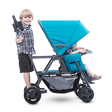 Joovy&reg; Caboose Ultralight Graphite Stand-On Tandem Stroller in Red. View a larger version of this product image.