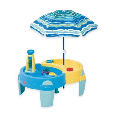 sand and water table with umbrella