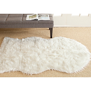 Safavieh Faux Sheep Skin Hide 5-Foot x 7-Foot Area Rug in Ivory. View a larger version of this product image.