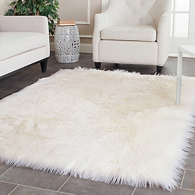 Safavieh Faux Sheep Skin 4-Foot x 6-Foot Area Rug in Ivory. View a larger version of this product image.