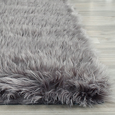 Safavieh Faux Sheep Skin 5-Foot x 7-Foot Area Rug in Grey. View a larger version of this product image.
