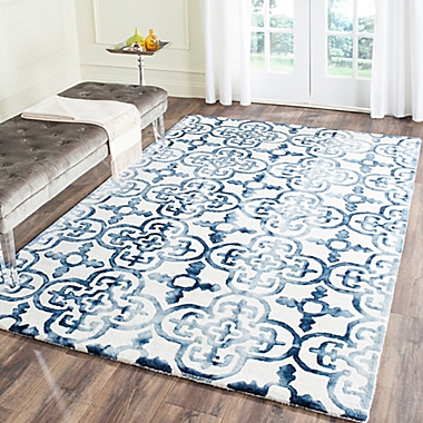 Safavieh Dip Dye Clover 5-Foot x 8-Foot Area Rug in Ivory/Navy. View a larger version of this product image.