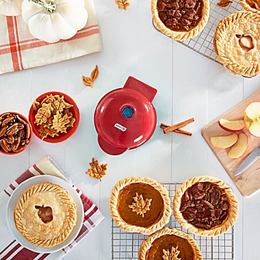 Dash&reg; Mini Pie Maker in Red. View a larger version of this product image.