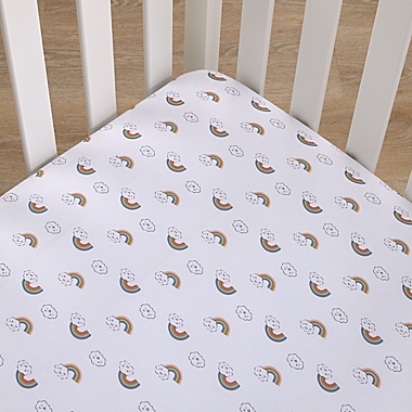 carter&#39;s&reg; Chasing Rainbows Fitted Crib Sheet in Peach. View a larger version of this product image.