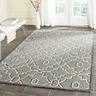 Alternate image 1 for Safavieh Four Seasons Links 5-Foot x 8-Foot Area Rug in Blue/Ivory
