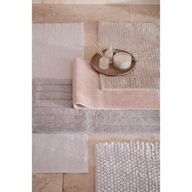 Haven&trade; 21&quot; x 34&quot; Organic Cotton Tufted Waffle Bath Rug in Pumice Tan. View a larger version of this product image.