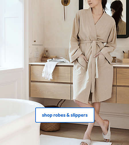 Woman wearing Haven bathrobe and criss cross slippers from the Haven collection