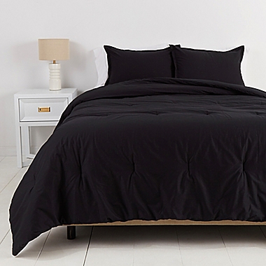 Simply Essential&trade; Garment Washed Solid 3-Piece Full/Queen Comforter Set in Tuxedo Black. View a larger version of this product image.
