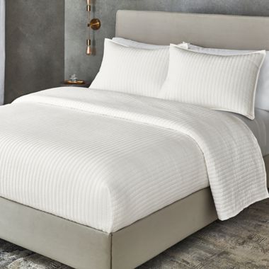 The Threadery&trade; Silk Stretch 3-Piece King Quilt Set in Vanilla. View a larger version of this product image.