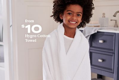 Child wrapped in Nestwell Hygro Cotton Towel - available exclusively at Bed Bath & Beyond starting at $10.