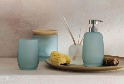 Glass and wood containers encourage a peaceful space.