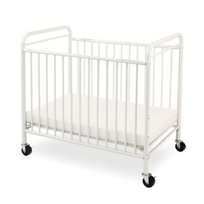 white portable crib