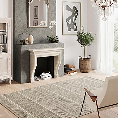 Bee &amp; Willow&trade; Riverview 6&#39;6 x 9&#39; Indoor/Outdoor Area Rug in Tan. View a larger version of this product image.
