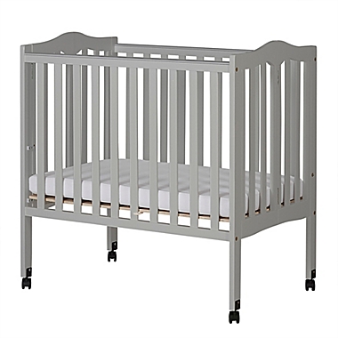 Dream On Me 2-in-1 Lightweight Folding Portable Mini Crib in Grey Pebble. View a larger version of this product image.