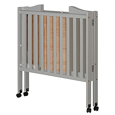 Dream On Me 2-in-1 Lightweight Folding Portable Mini Crib in Grey Pebble. View a larger version of this product image.