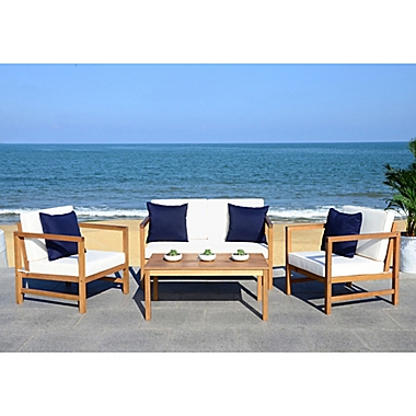 Safavieh Montez 4-Piece Acacia Wood Conversation Set in Teak/Navy with Accent Pillows. View a larger version of this product image.