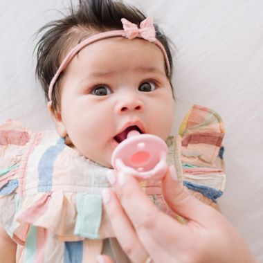Itzy Ritzy&reg; Sweetie Soother&trade; 2-Pack Silicone Pacifier in Pink Bow. View a larger version of this product image.