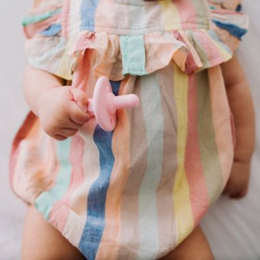 Itzy Ritzy&reg; Sweetie Soother&trade; 2-Pack Silicone Pacifier in Pink Bow. View a larger version of this product image.