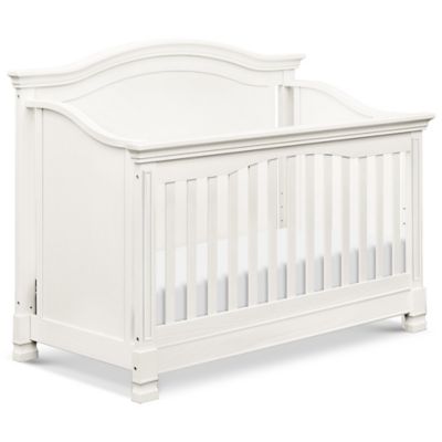 white crib with bow