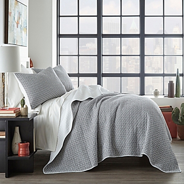 City Scene&reg; Leaves 2-Piece Reversible Twin Quilt Set in Black. View a larger version of this product image.